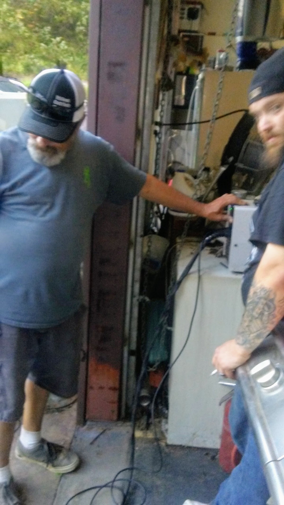 Flinn's technicians working on HVAC equipment